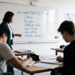 Conjugaison du verbe être à l'imparfait écrite à la main sur un cahier scolaire